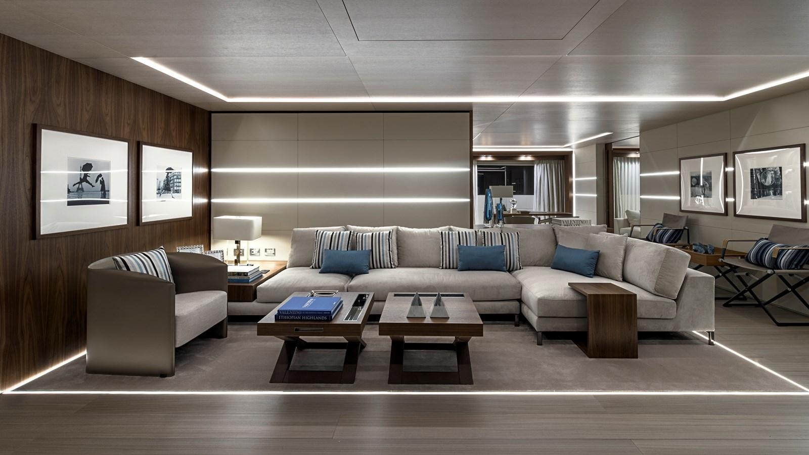 a living room with a couch and a coffee table aboard UTOPIA IV Yacht for Sale