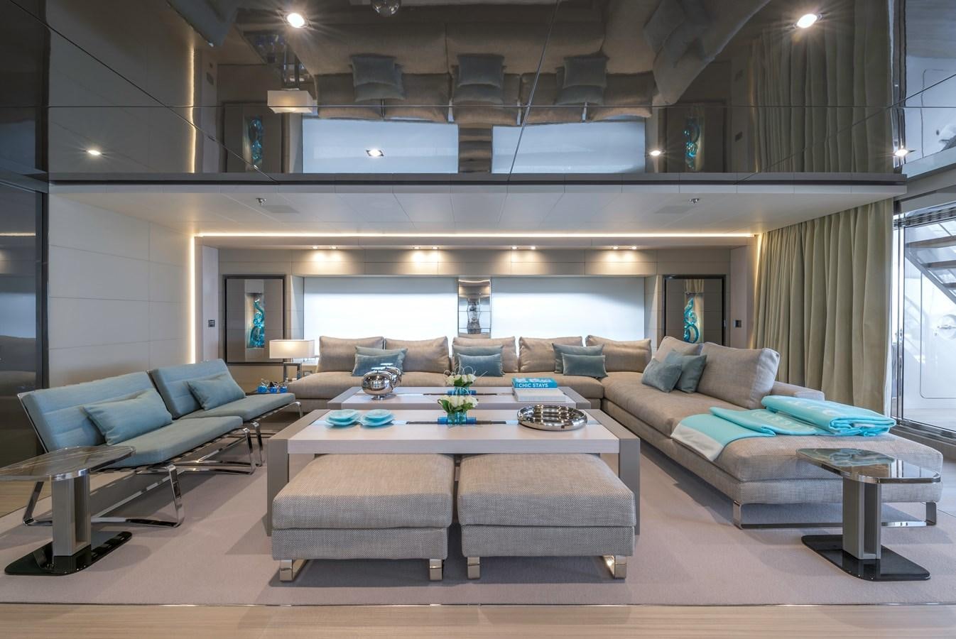 a living room with a couch and a coffee table aboard UTOPIA IV Yacht for Sale