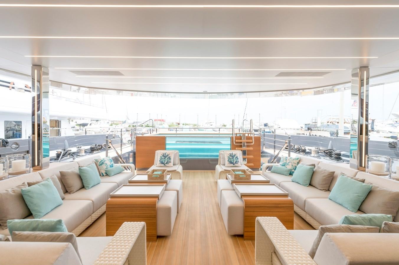 a living room with a large pool aboard UTOPIA IV Yacht for Charter