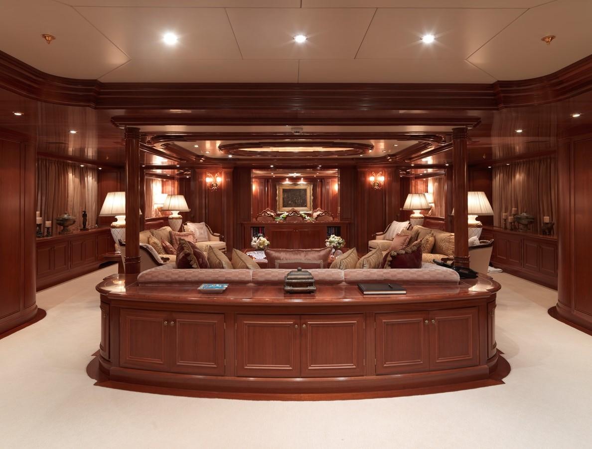 a large living room with a large mirror aboard APOGEE Yacht for Sale