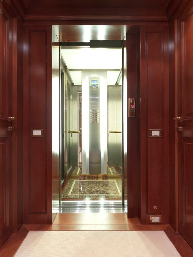 a large elevator with glass doors aboard APOGEE Yacht for Sale