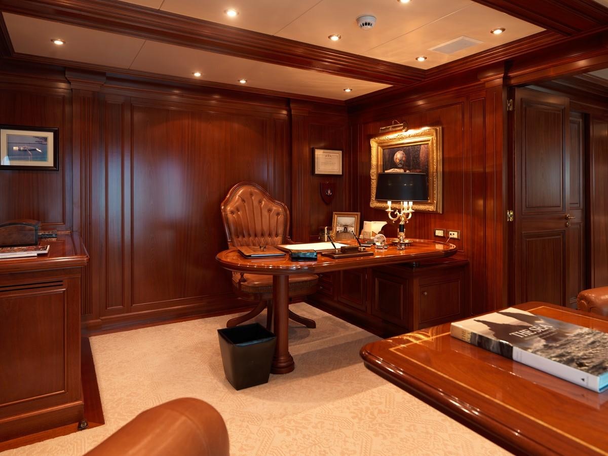 a room with a desk and chairs aboard APOGEE Yacht for Sale