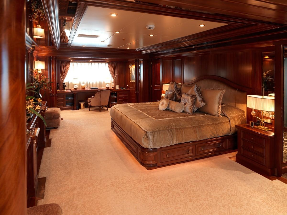 a large bed in a hotel room aboard APOGEE Yacht for Sale