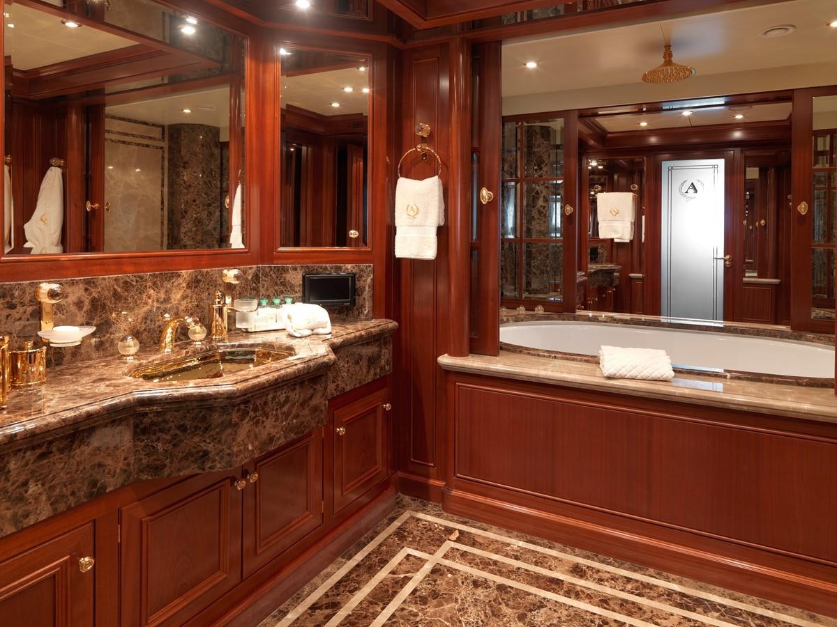 a bathroom with a large mirror aboard APOGEE Yacht for Sale