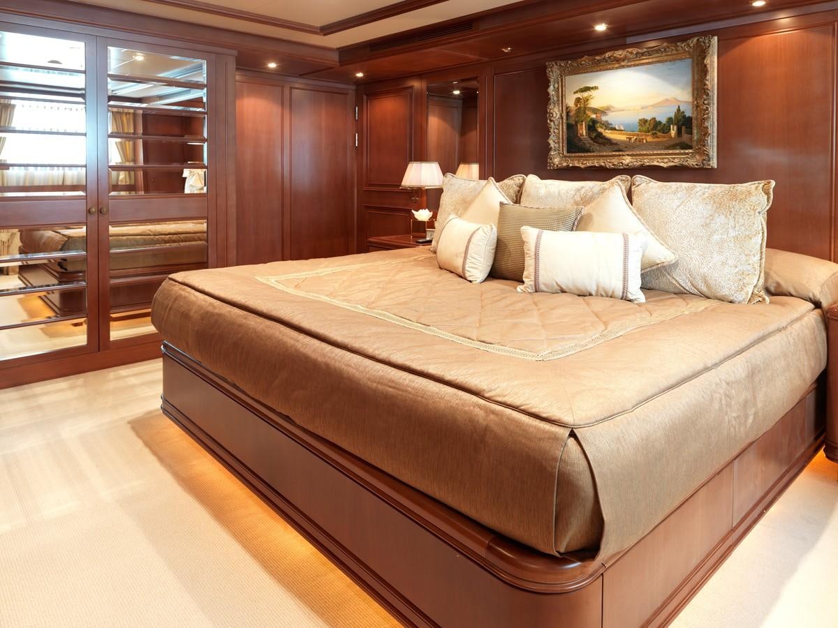 a bed in a room aboard APOGEE Yacht for Sale