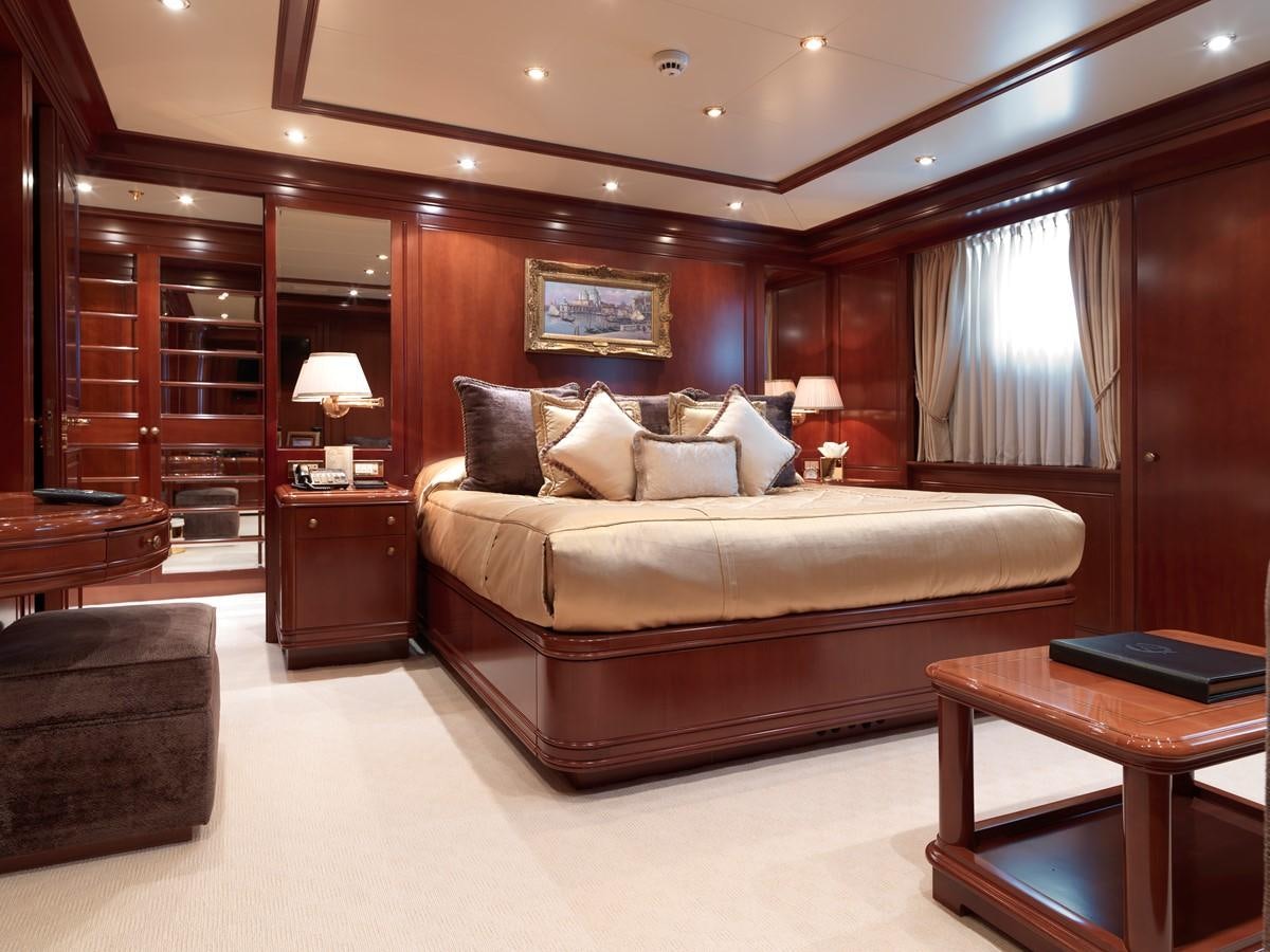 a large bed in a hotel room aboard APOGEE Yacht for Sale