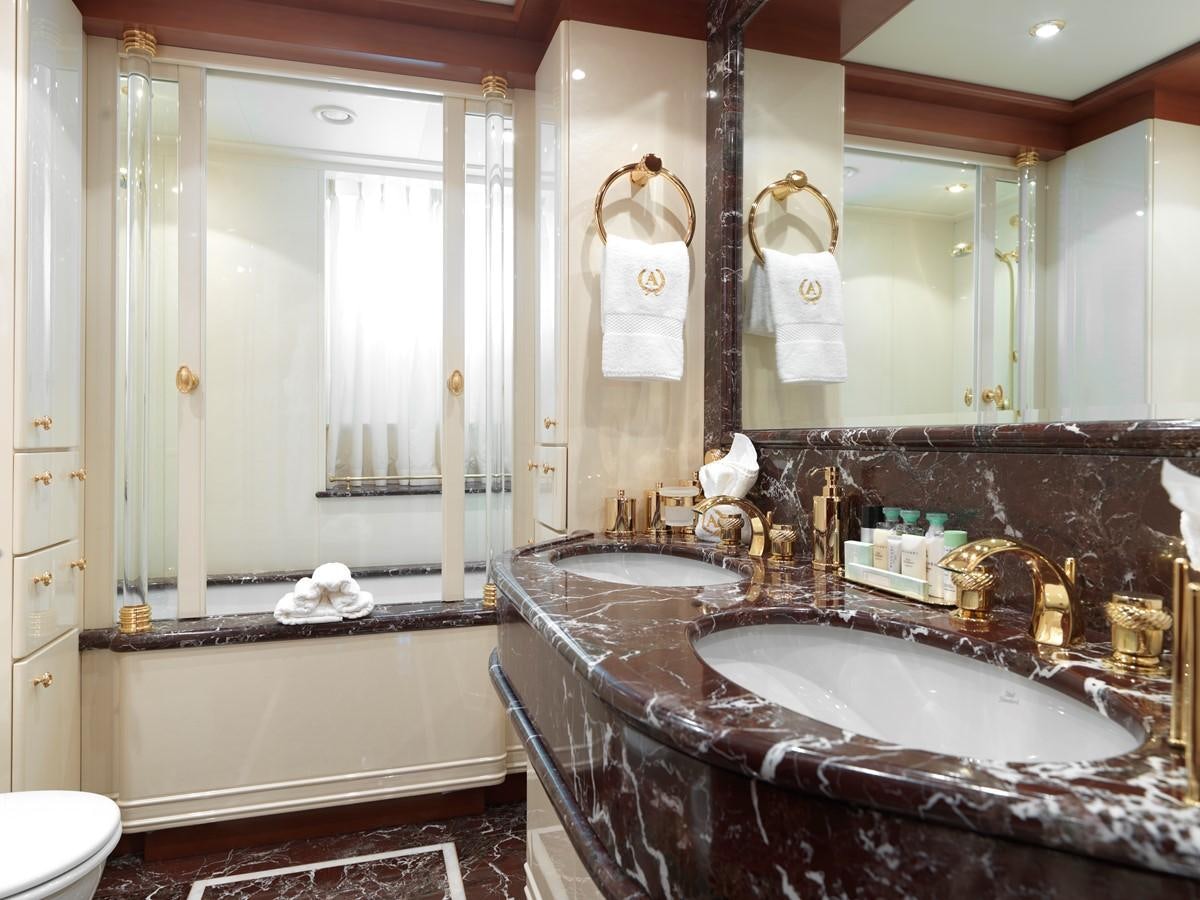 a bathroom with a bathtub and sink aboard APOGEE Yacht for Sale