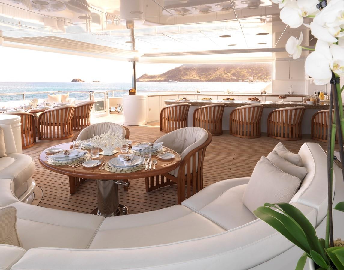 a dining room with a large table aboard APOGEE Yacht for Sale