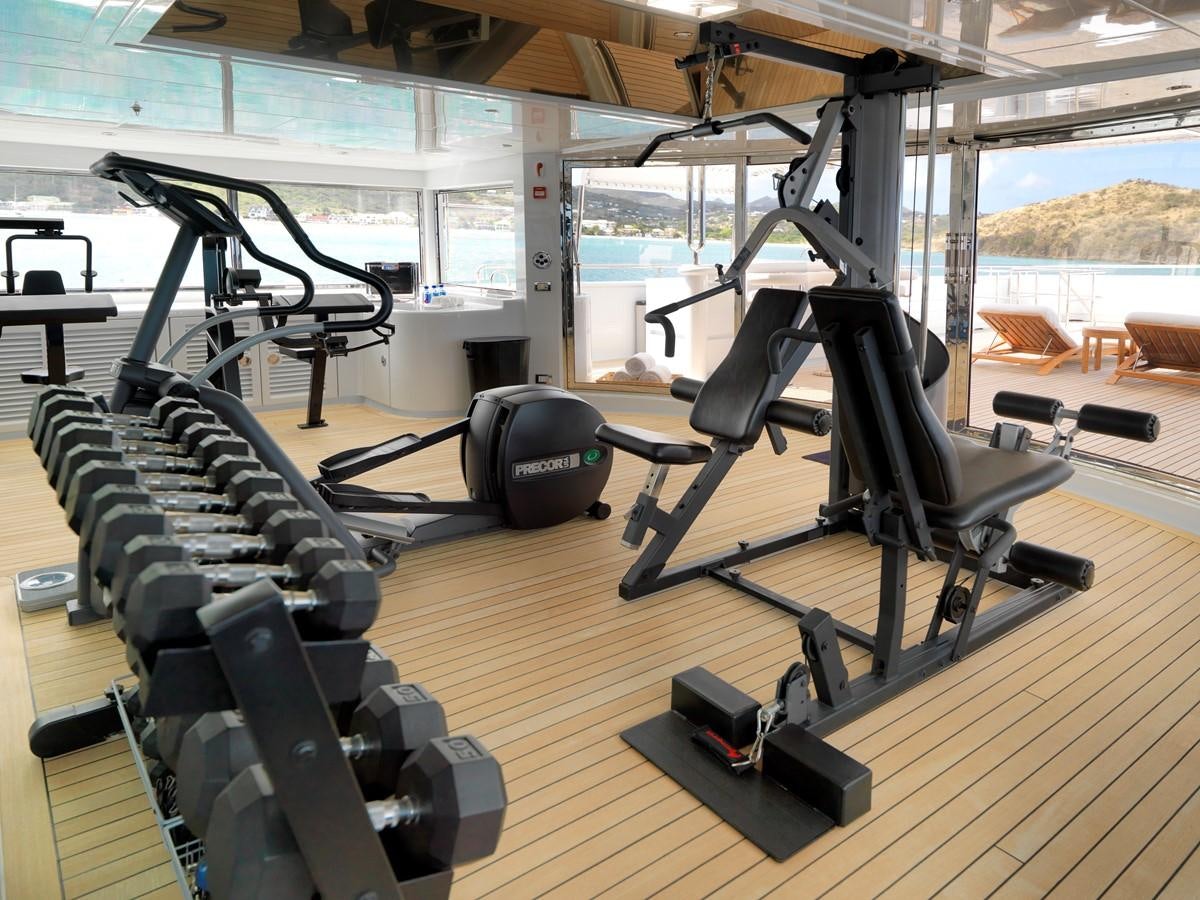gym with exercise equipment aboard APOGEE Yacht for Sale