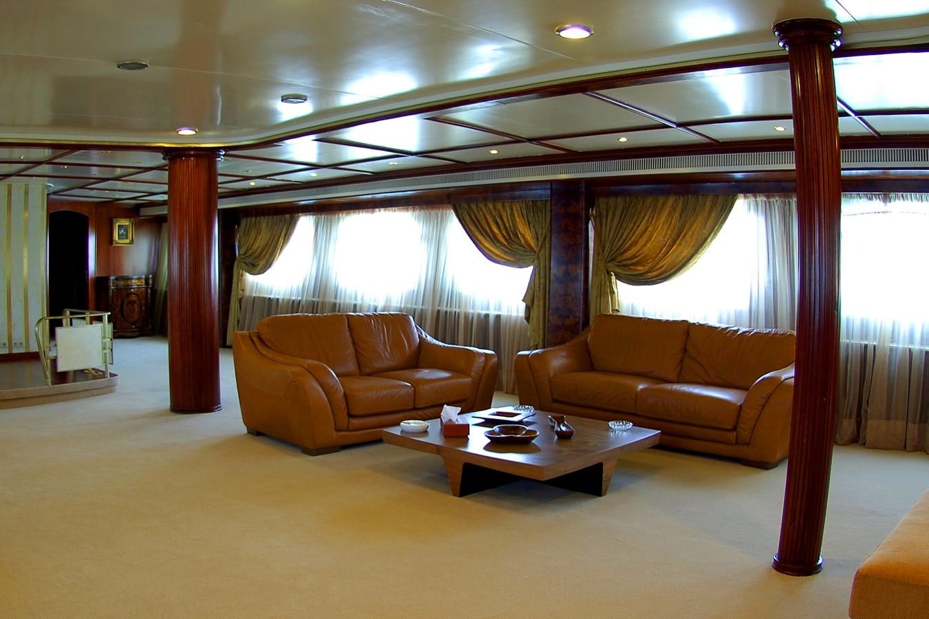 a living room with couches and a table aboard BLUE DAWN Yacht for Sale
