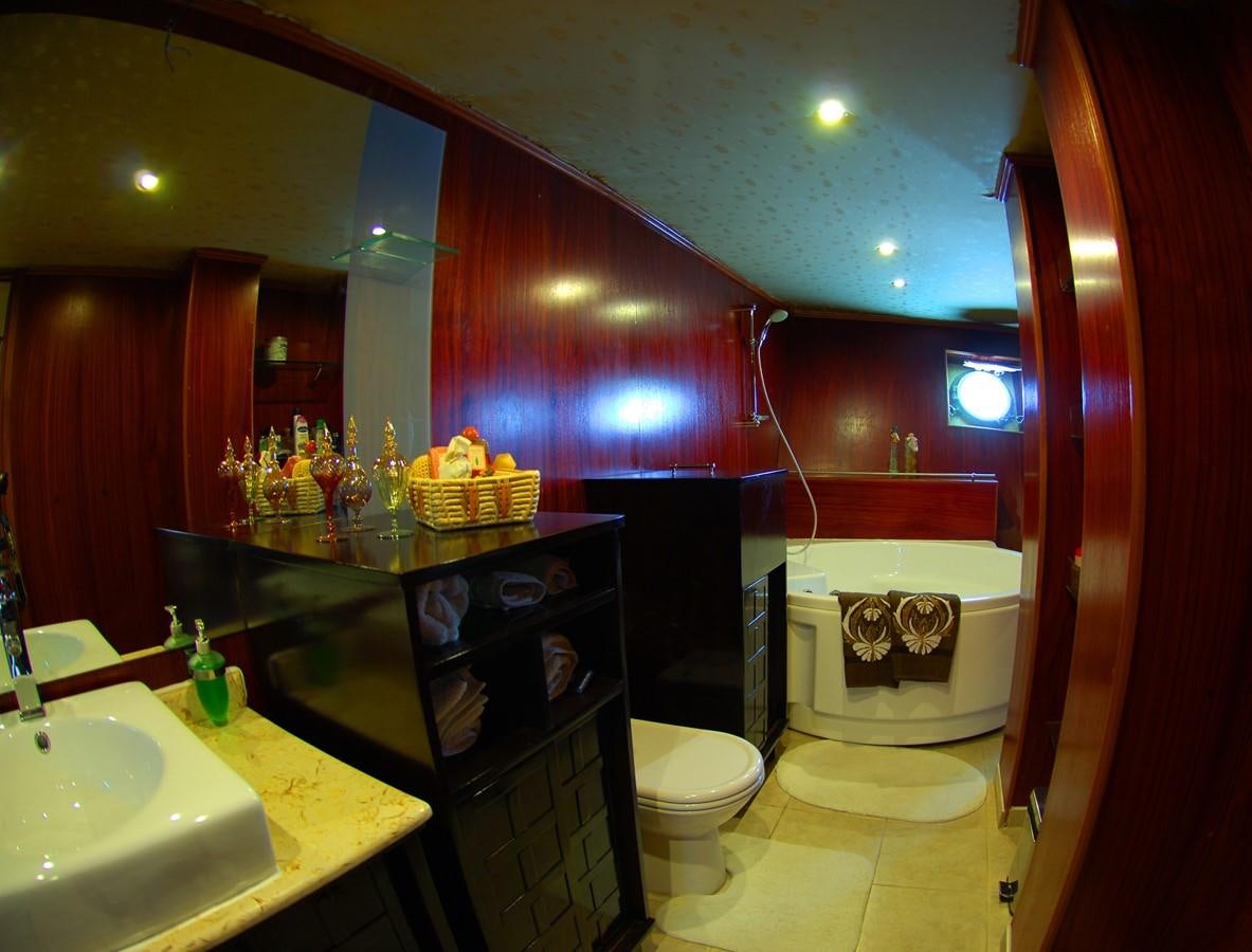 a bathroom with red walls aboard BLUE DAWN Yacht for Sale