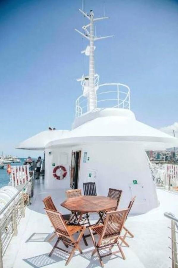 a table and chairs outside a building aboard BLUE DAWN Yacht for Sale