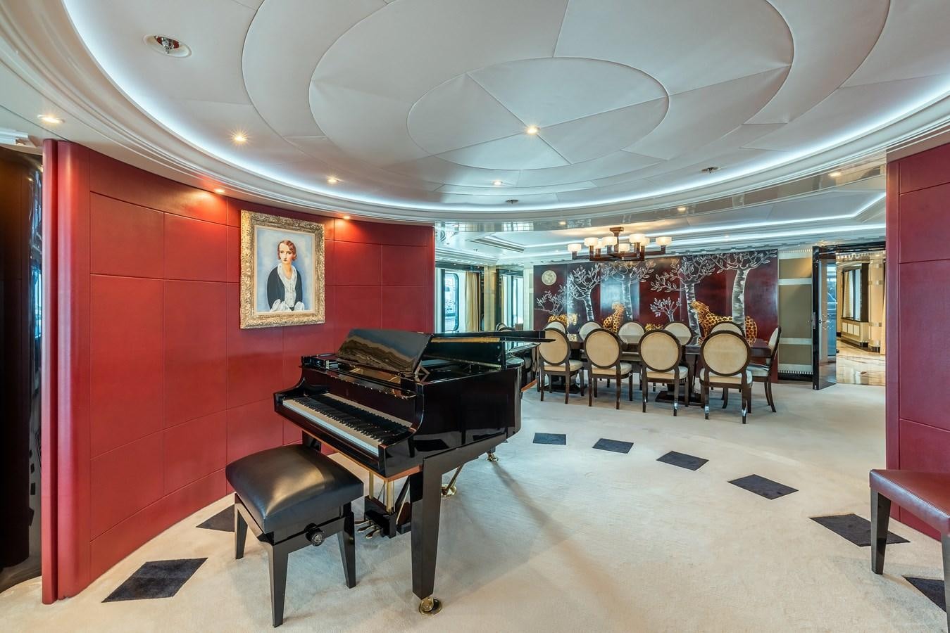 a room with a piano and chairs aboard MARGUERITE Yacht for Sale