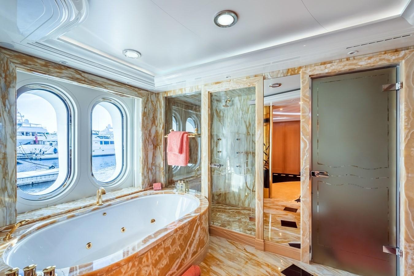 a bathroom with a tub and shower aboard MARGUERITE Yacht for Sale