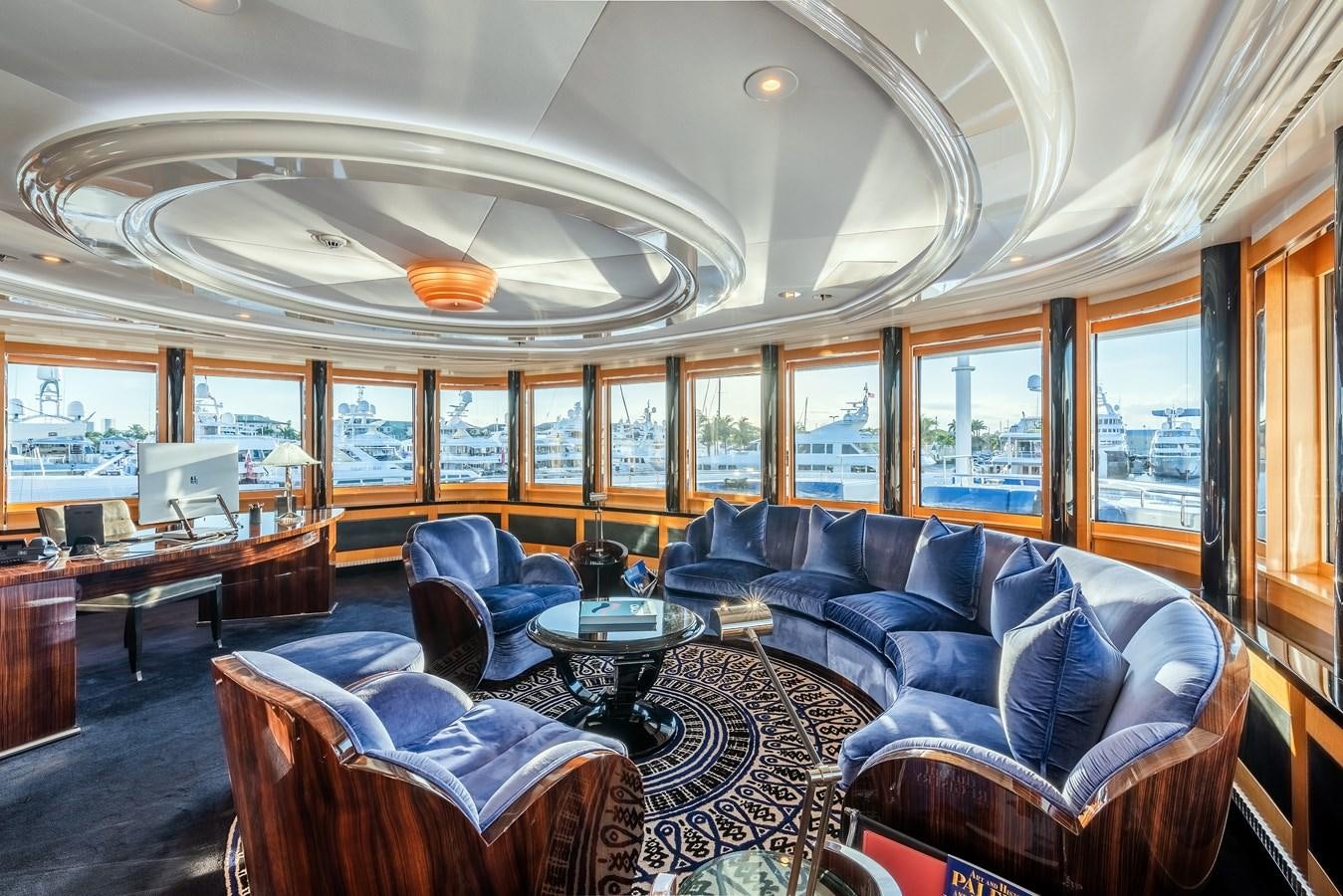 a large living room with a large window aboard MARGUERITE Yacht for Sale