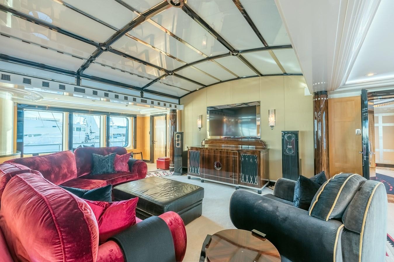 a living room with a couch and a tv aboard MARGUERITE Yacht for Sale