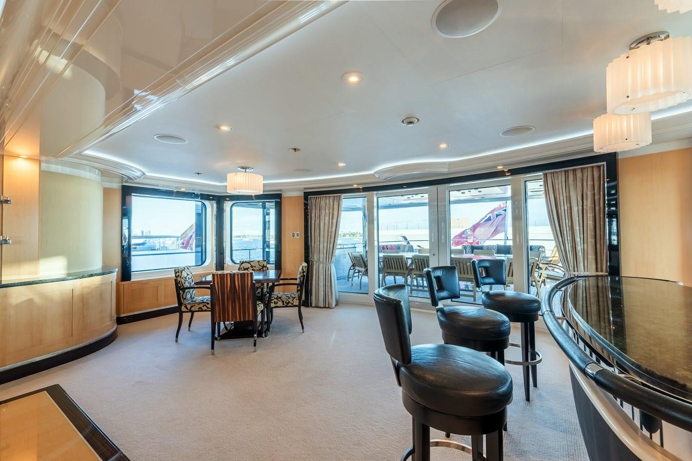 a room with a table and chairs aboard MARGUERITE Yacht for Sale