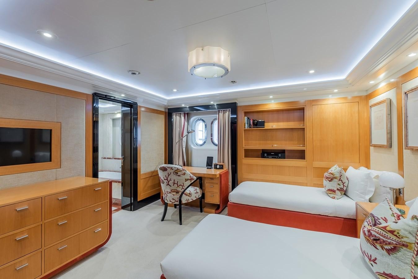 a bedroom with a bed and a tv aboard MARGUERITE Yacht for Sale