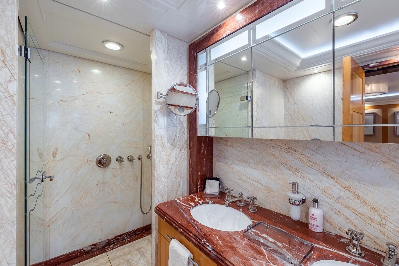 a bathroom with a countertop sink and mirror aboard MARGUERITE Yacht for Sale
