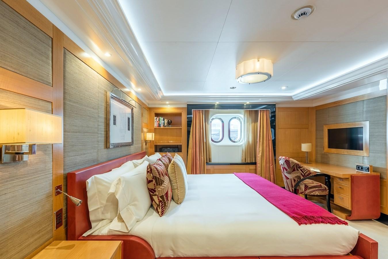 a bedroom with a bed and a tv aboard MARGUERITE Yacht for Sale