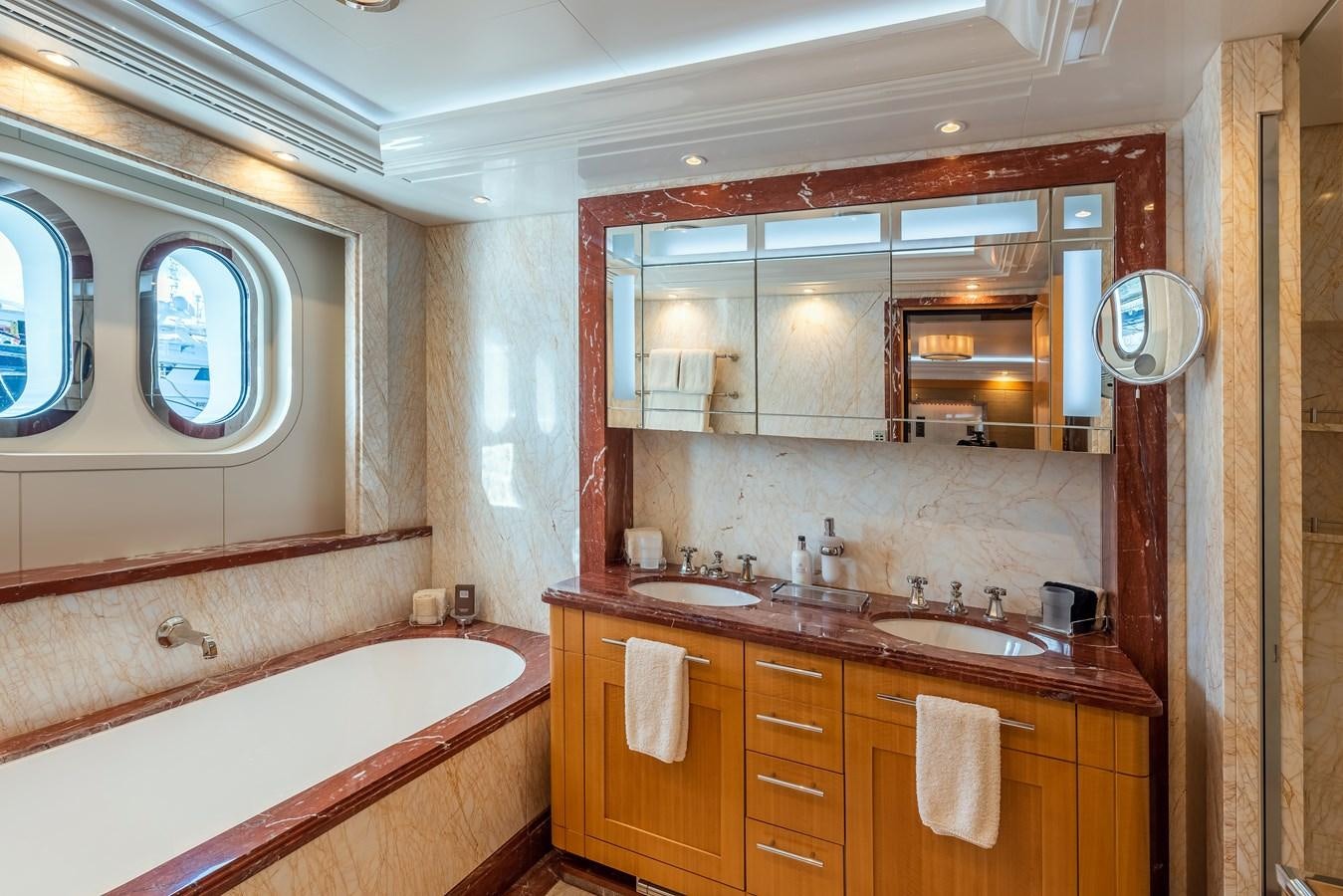 a bathroom with a large mirror aboard MARGUERITE Yacht for Sale