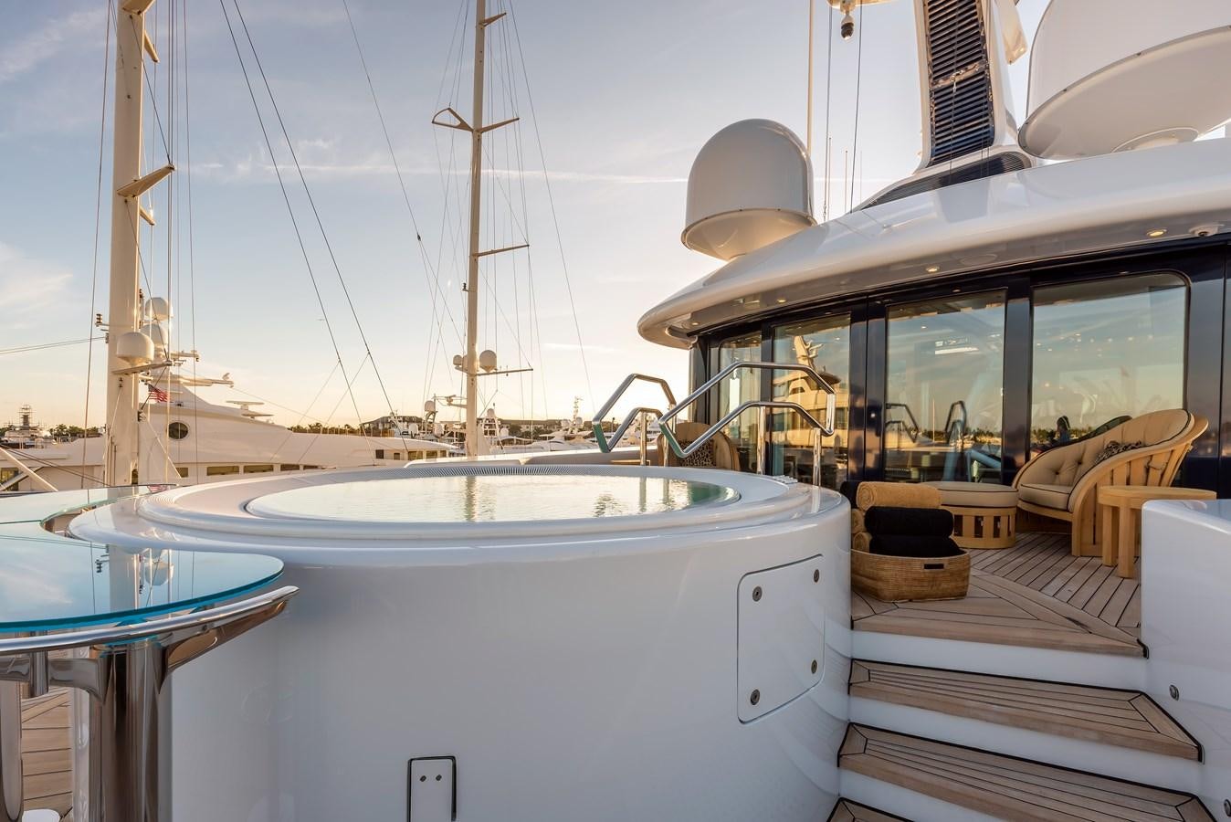 a boat with a deck and chairs aboard MARGUERITE Yacht for Sale