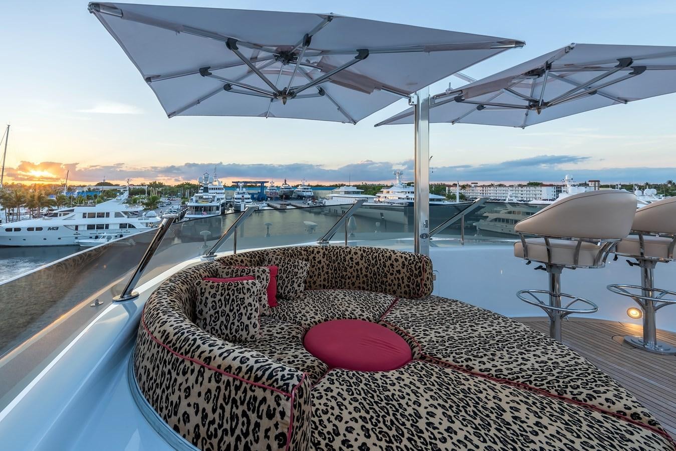 a deck with a view of a city and water aboard MARGUERITE Yacht for Sale