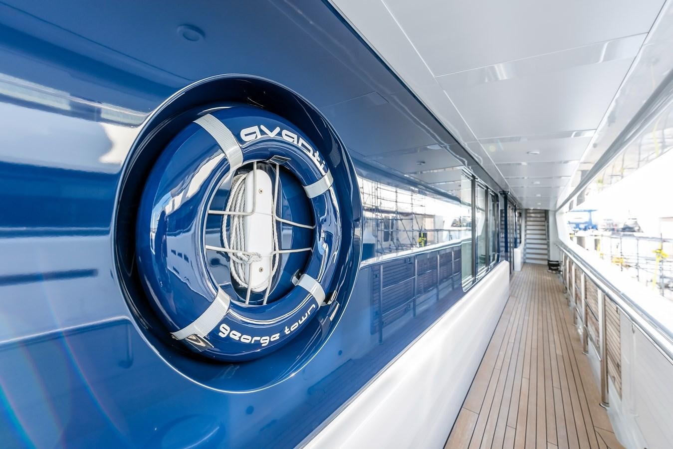 a large blue car aboard MARGUERITE Yacht for Sale
