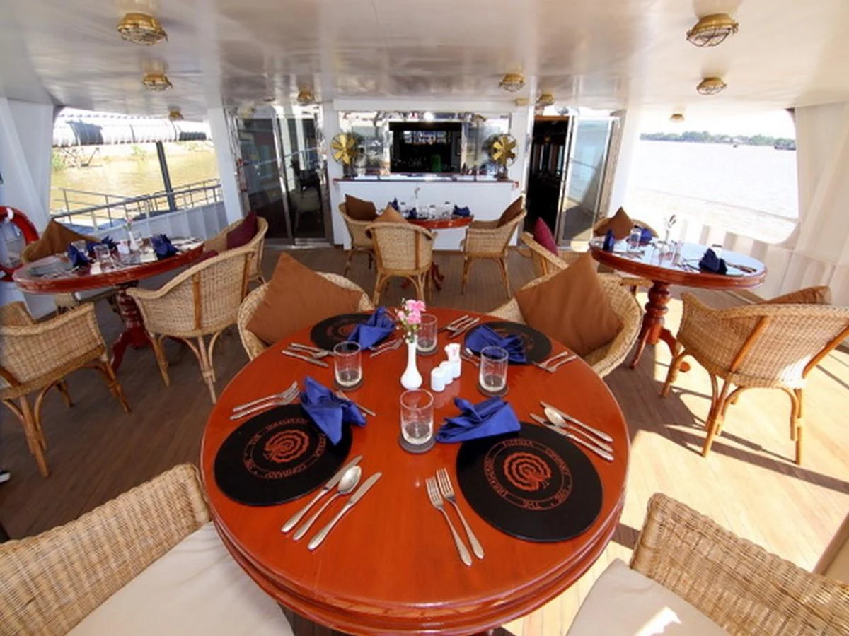 a dining room with a table and chairs aboard ANDAMAN EXPLORER Yacht for Sale