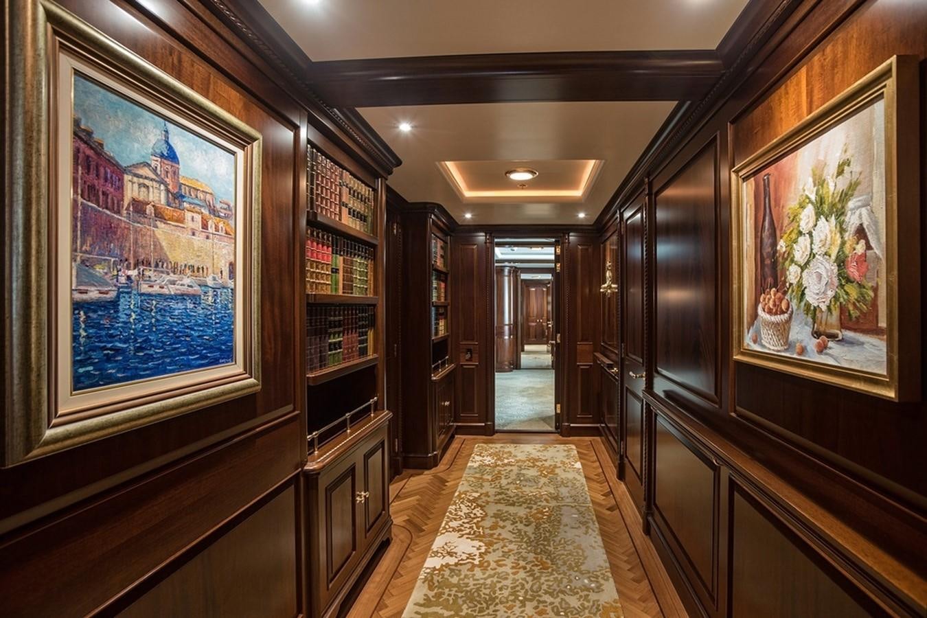 a hallway with a large painting aboard PARAFFIN Yacht for Sale