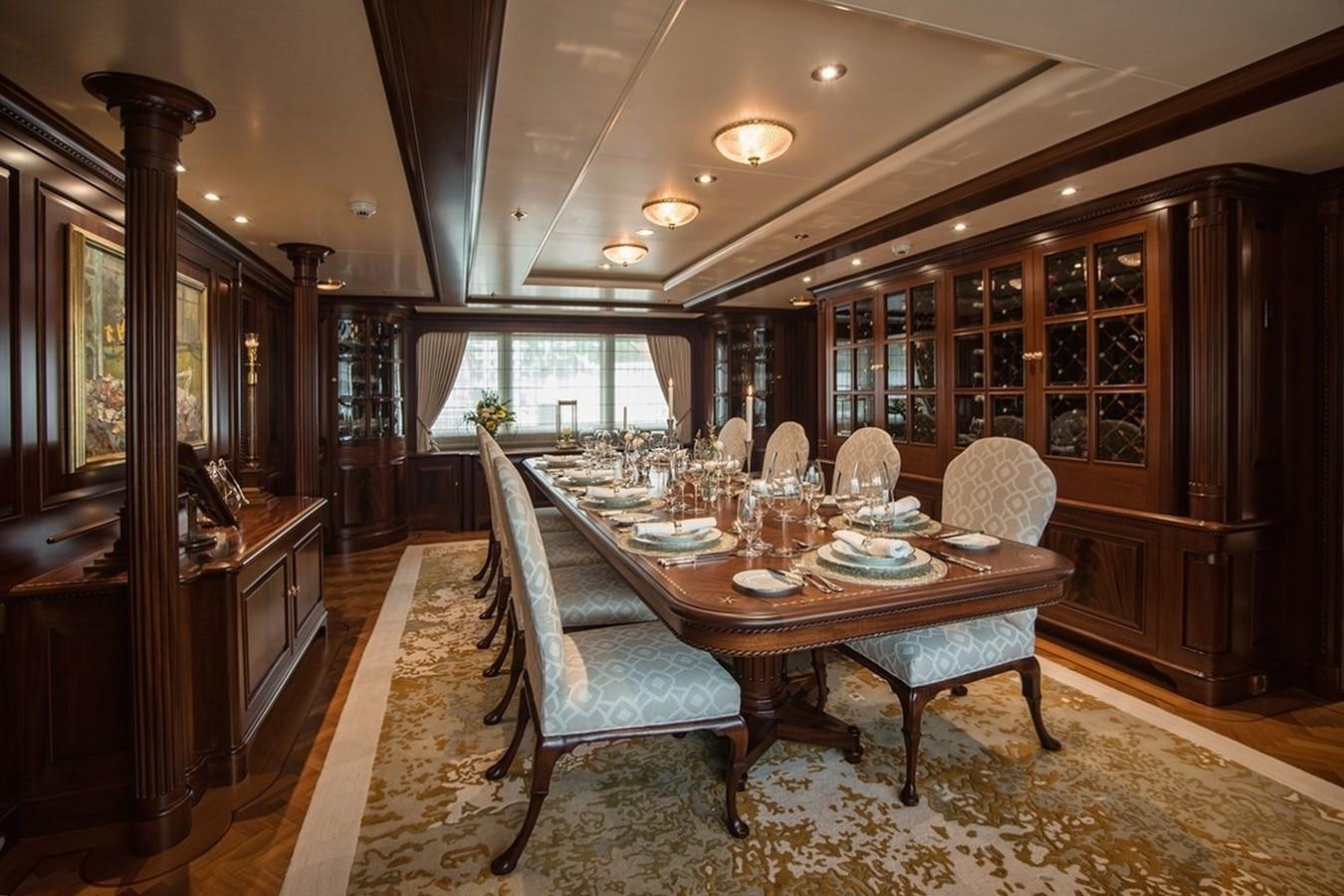 a dining room with a table and chairs aboard PARAFFIN Yacht for Sale