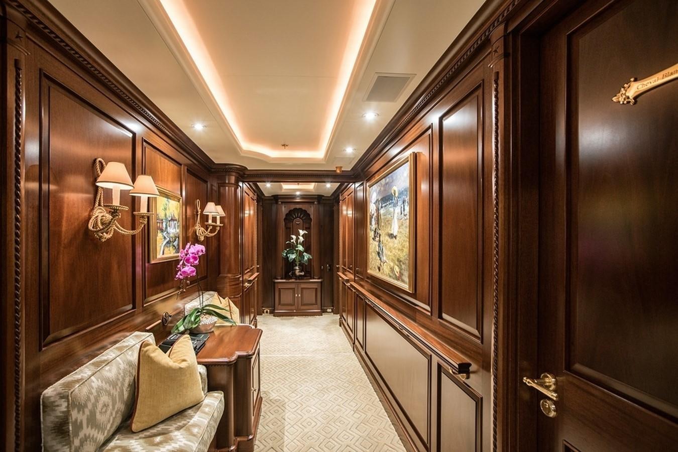 a room with a mirror and a couch aboard PARAFFIN Yacht for Sale