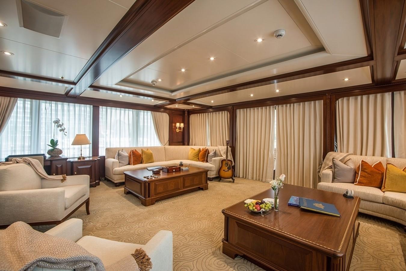 a living room with a couch and a coffee table aboard PARAFFIN Yacht for Sale