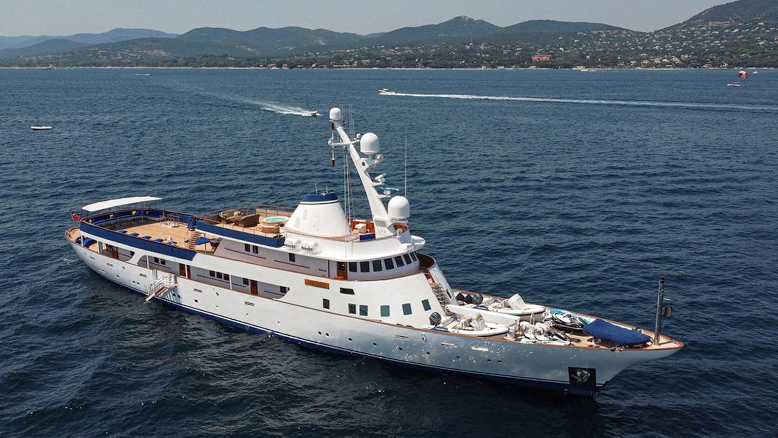 a large white boat in the water aboard PALOMA Yacht for Sale