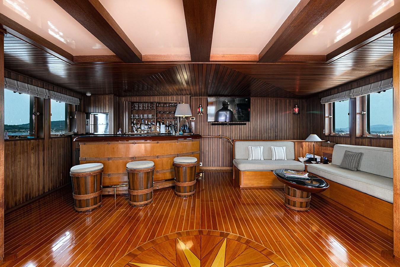 a large living room with wood floors aboard PALOMA Yacht for Sale