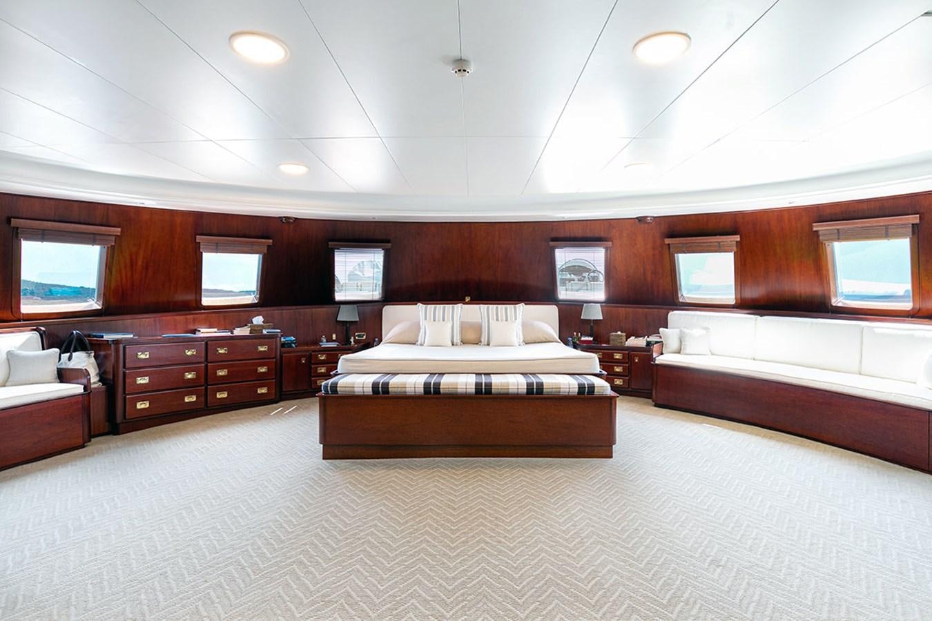 a room with a bed and a couch aboard PALOMA Yacht for Sale