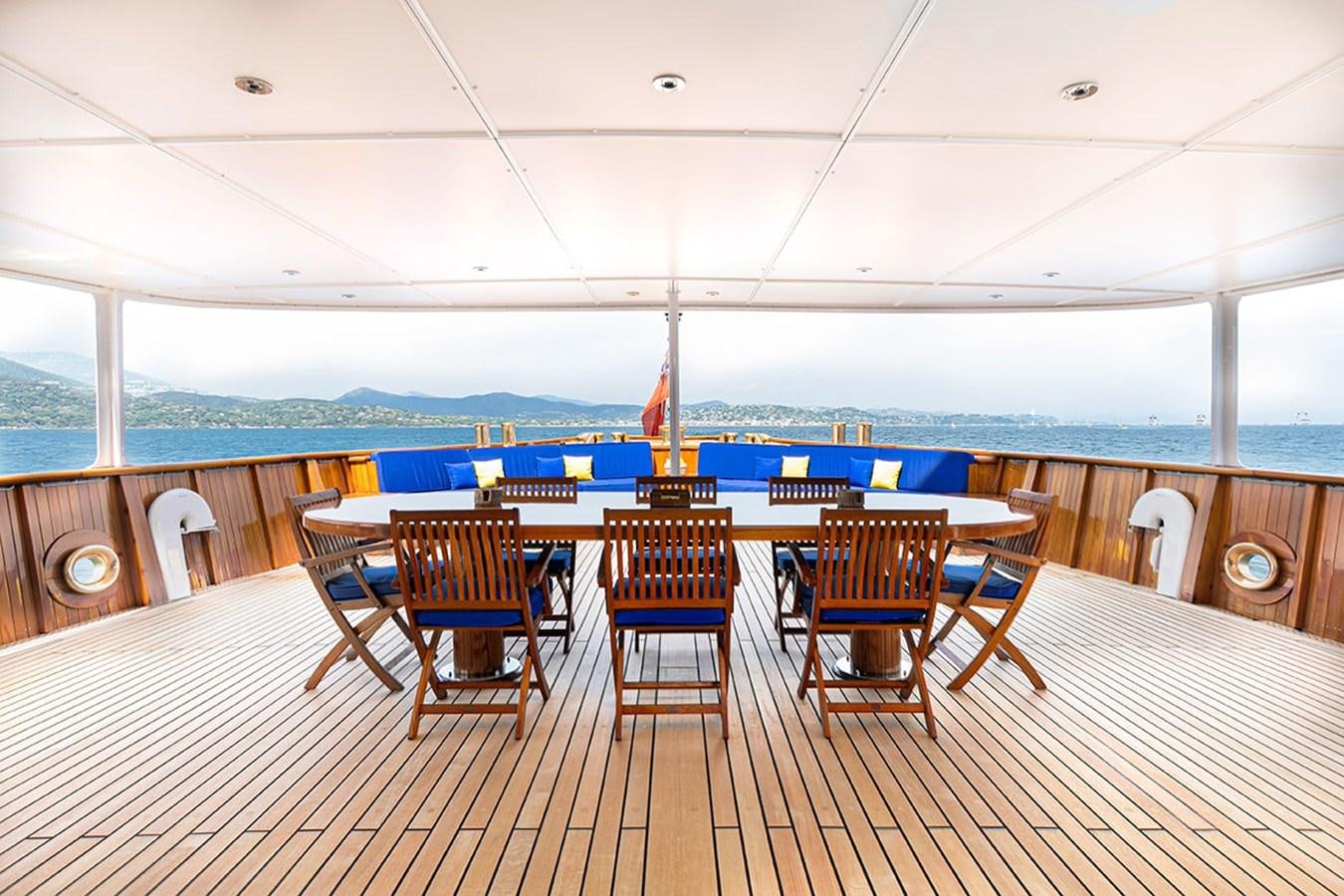 a room with a table and chairs aboard PALOMA Yacht for Sale