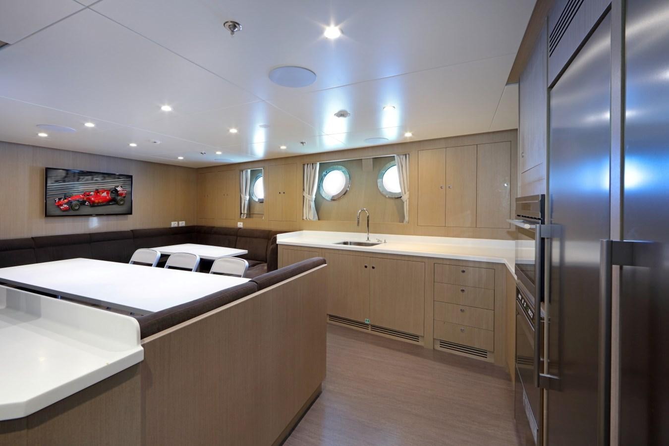 a kitchen with a refrigerator and a sink aboard FORMOSA Yacht for Sale
