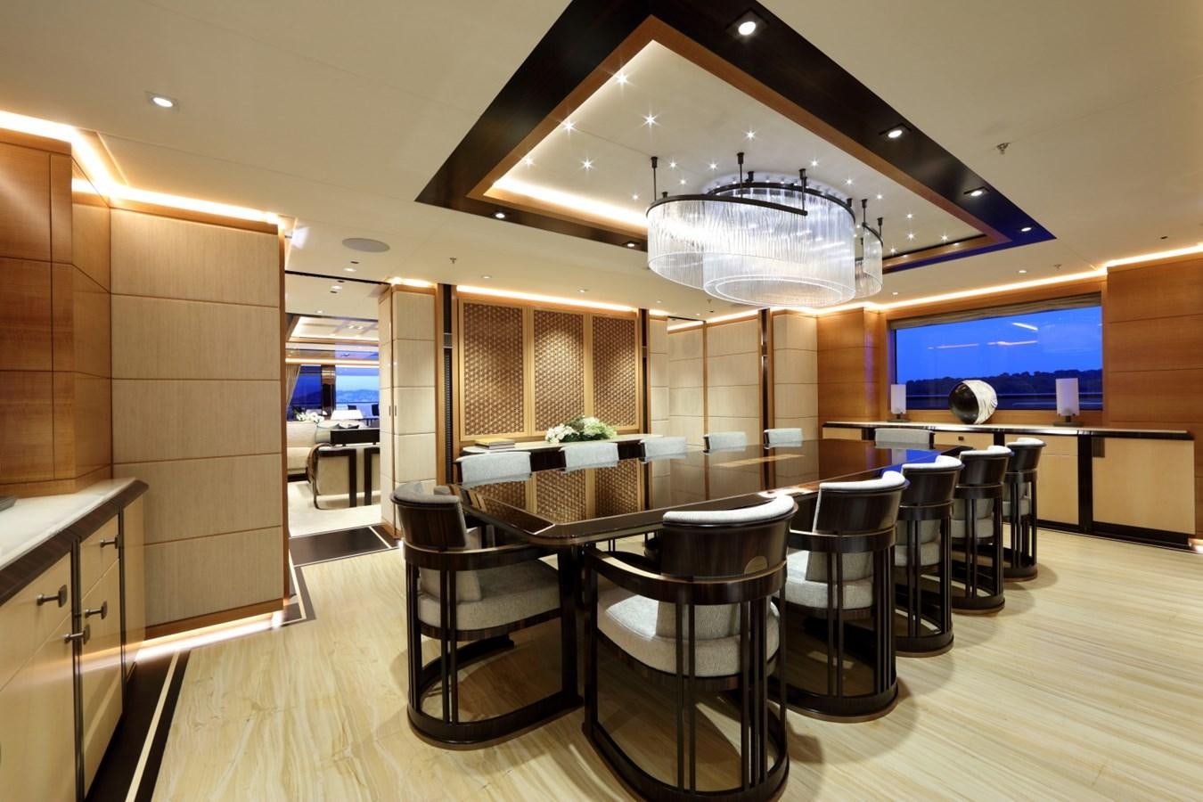 a room with tables and chairs aboard FORMOSA Yacht for Sale