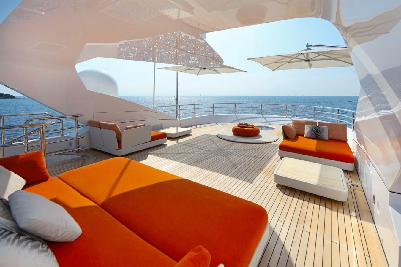 a lounge area with a large umbrella aboard FORMOSA Yacht for Sale