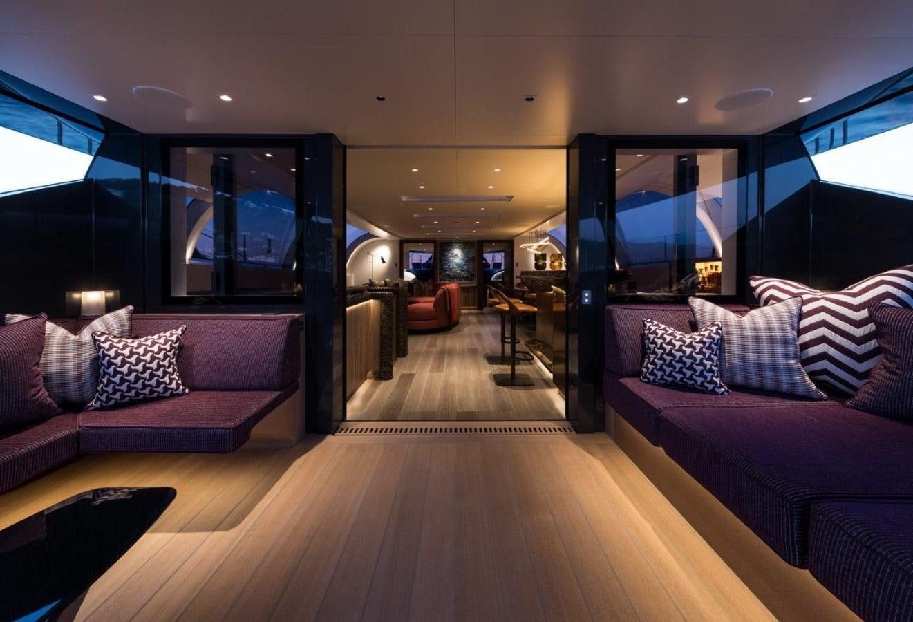 a living room with a wood floor aboard NGONI Yacht for Sale