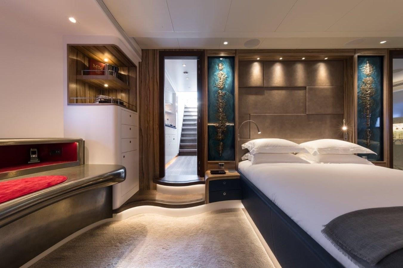 a bedroom with a large bed aboard NGONI Yacht for Sale