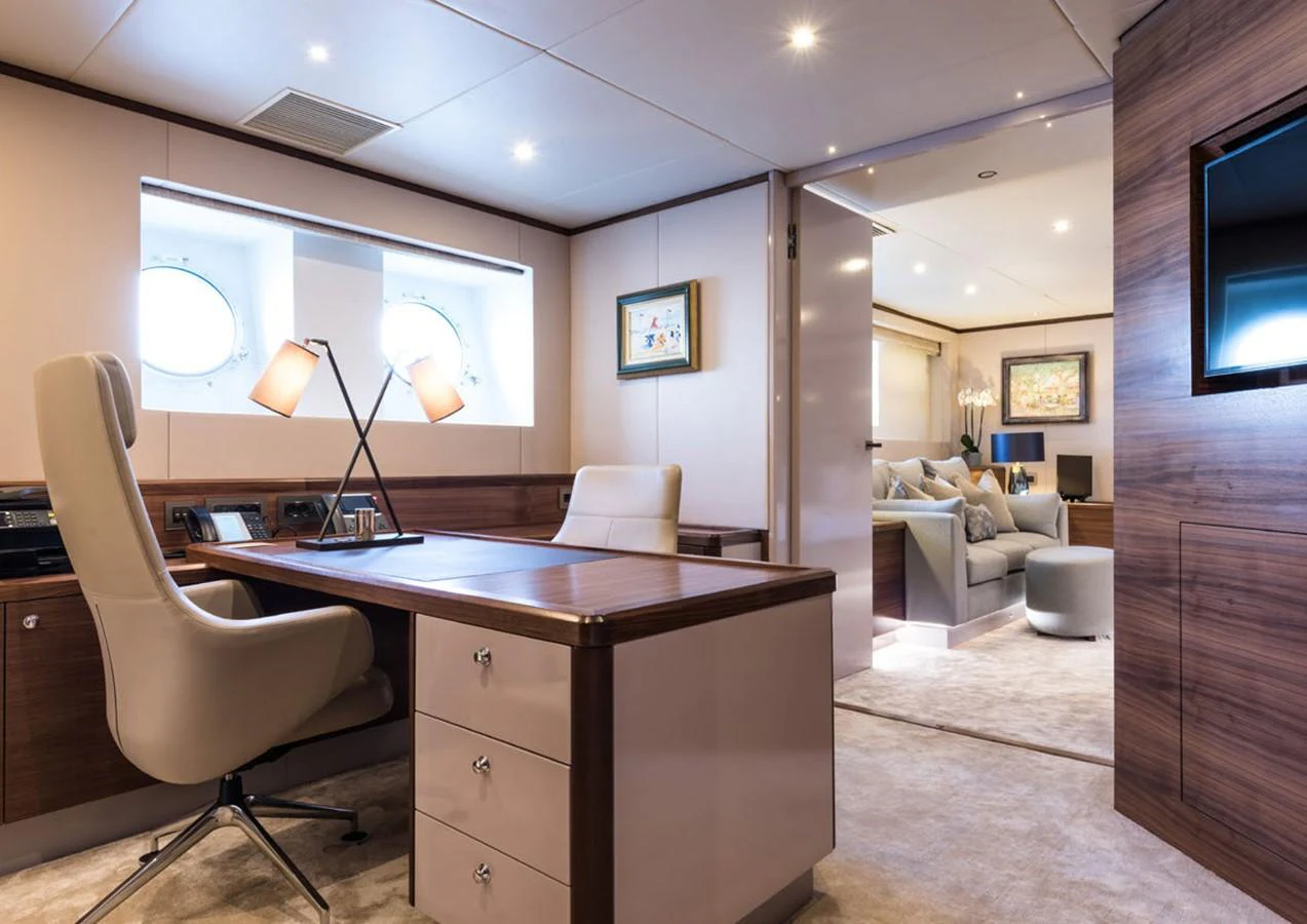 a room with a desk and a chair aboard LADY A Yacht for Sale