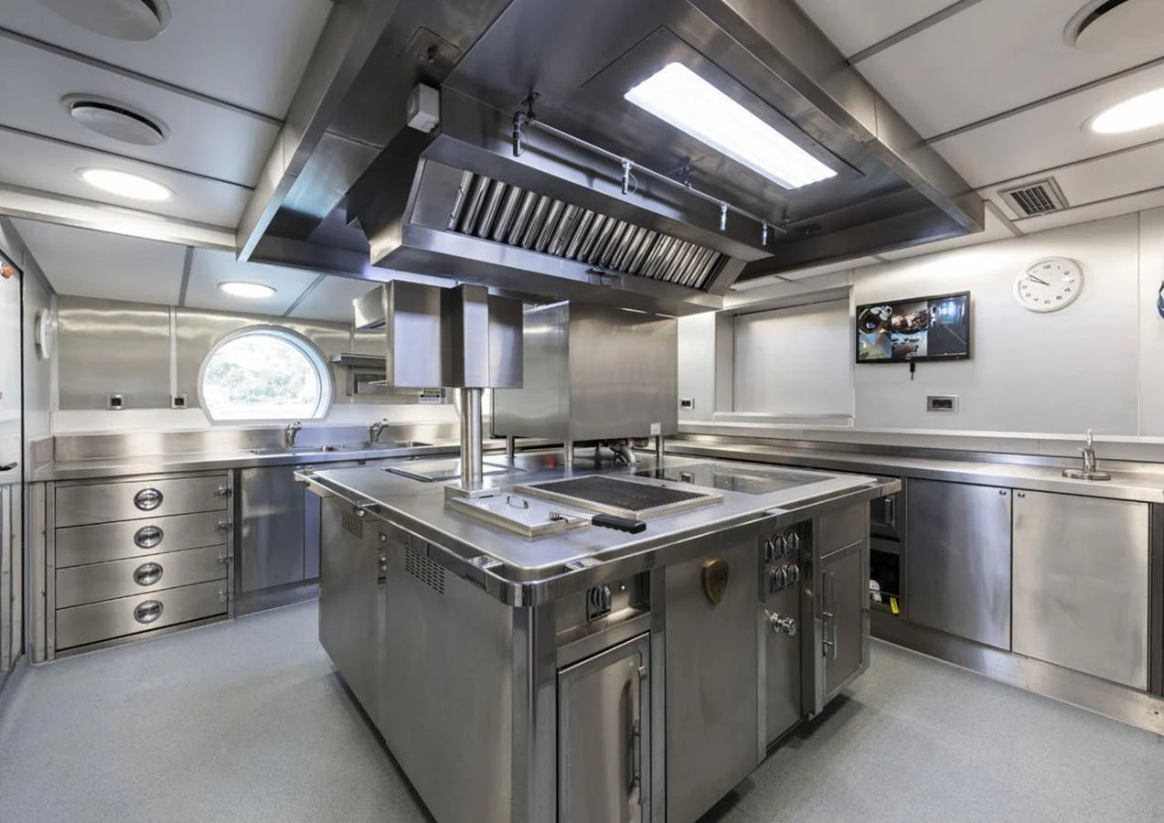 a kitchen with a large island aboard LADY A Yacht for Sale
