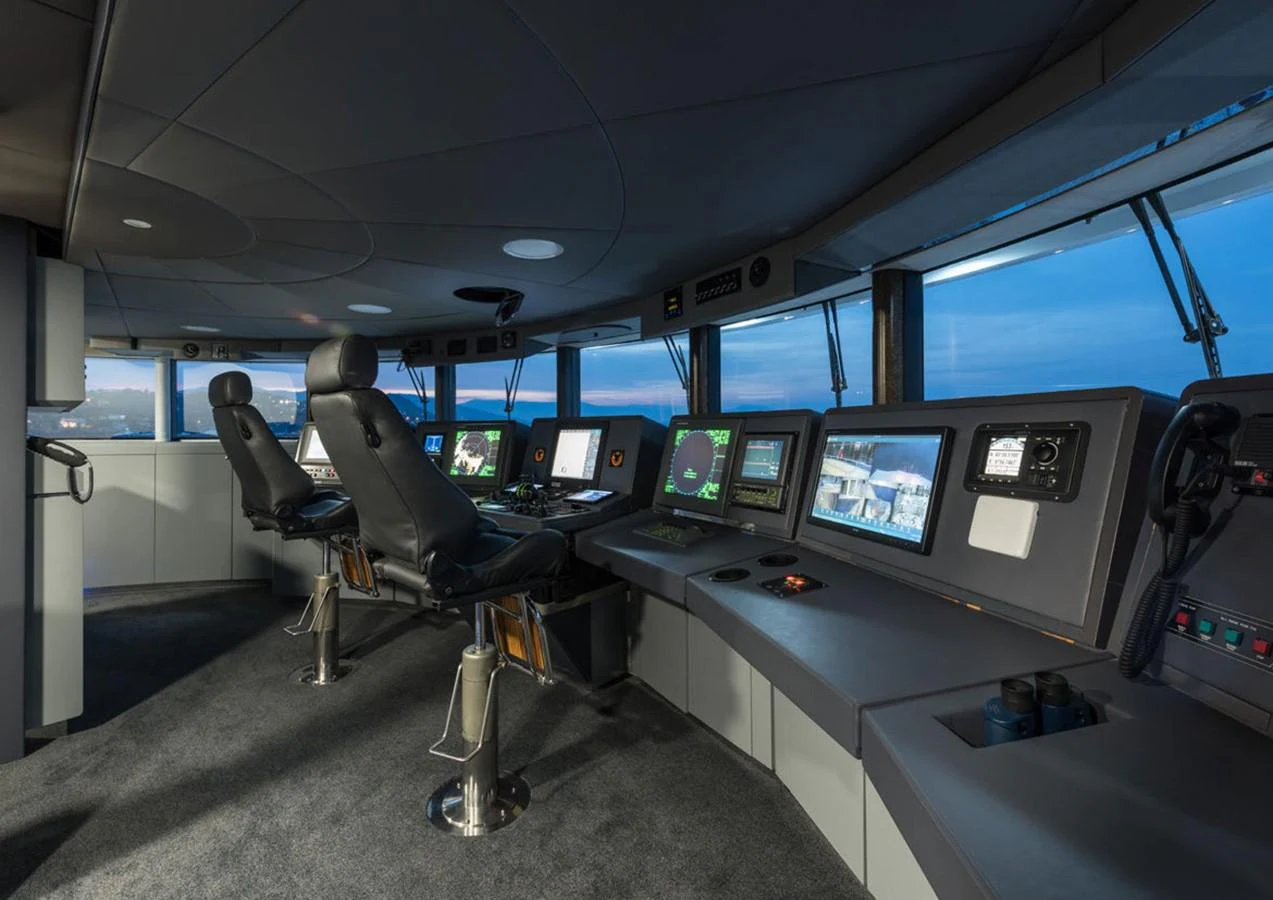 a room with many monitors and chairs aboard LADY A Yacht for Sale