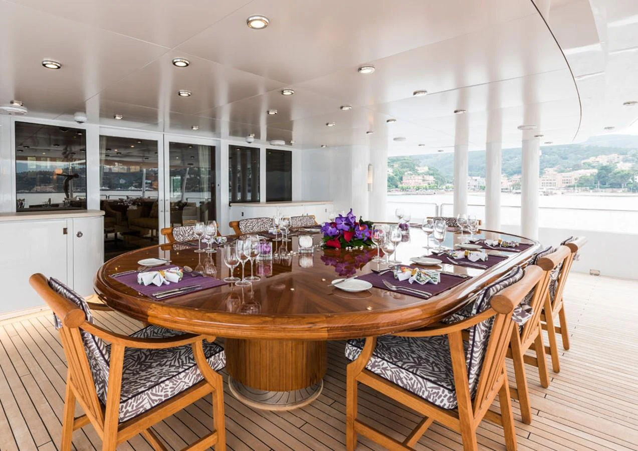 a dining table set for a meal aboard LADY A Yacht for Sale