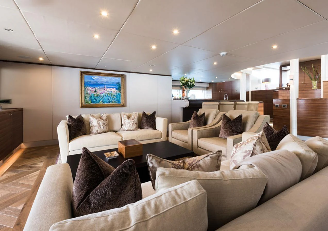 a living room with a couch and a tv aboard LADY A Yacht for Sale