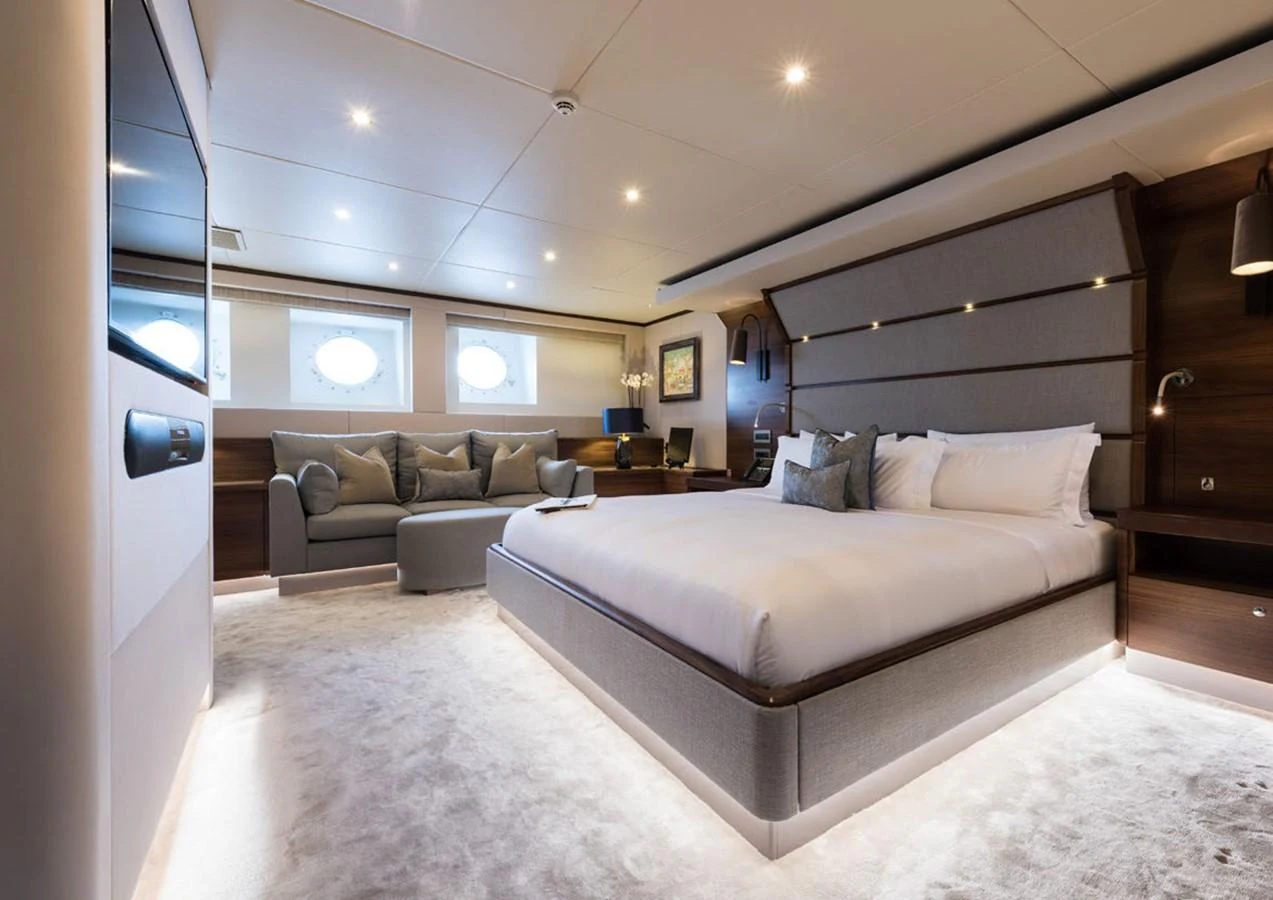 a large white bed in a room aboard LADY A Yacht for Sale