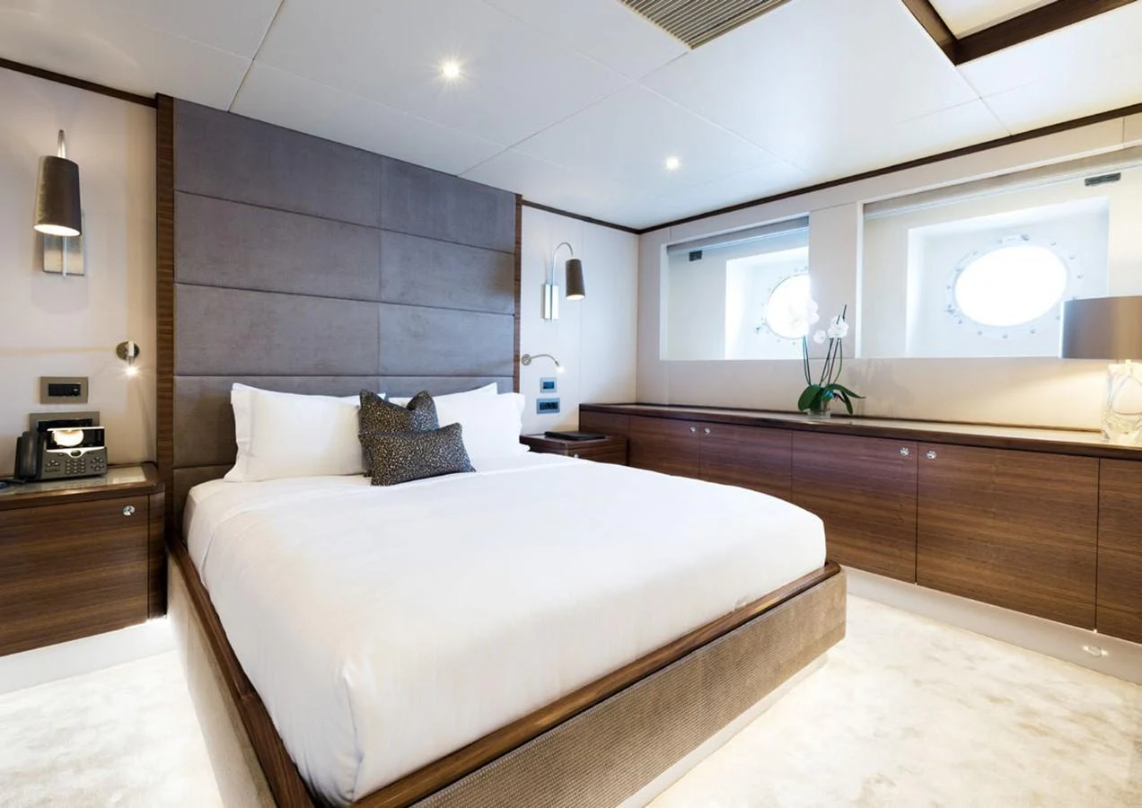 a large bedroom with a large bed aboard LADY A Yacht for Sale