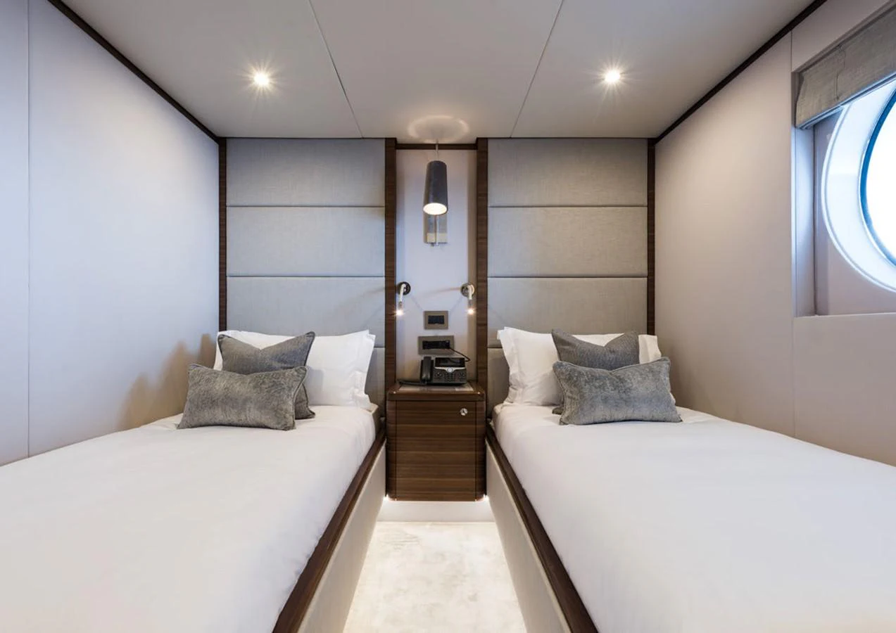 a room with two beds aboard LADY A Yacht for Sale